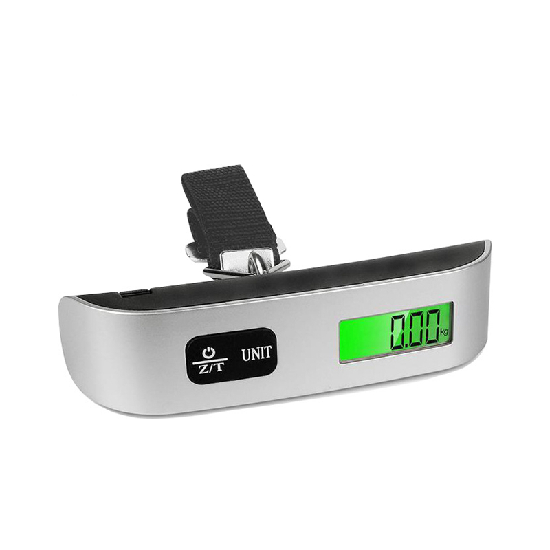 Báscula digital para equipaje apoyada sobre su base con la correa doblada.
